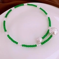 Detailed shot of green beaded necklace with silver metallic spheres on a white tray - 13# Necklace-Dark Green Beads Silver Ball