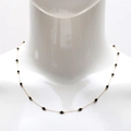 Detail view of 18K gold plated stainless steel necklace with black crystal beads on mannequin - 40+5cm / Black
