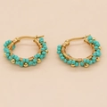 Close-up of Bohemian gold hoop earrings with turquoise beads and intricate wire wrapping - Turquoise Floral Style (GZ-E220031C)
