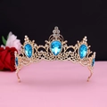 Detailed view of Baroque gold crown with blue teardrop crystals and white rhinestones - No.11 KC Gold (Lake Blue Stone)