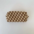 Detailed view of the checkered knit makeup bag with brown and beige woolen texture - Coffee Plaid