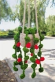 Close-up of handmade crochet potted plant with red berries and green leaves for car decor - No.1 (Beige Pot Green Leaves Red Fruit)