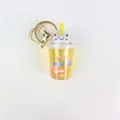 Yellow milk tea cup cat keychain with liquid glitter and sakura flower charms - Yellow Flower