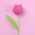 Detailed view of hand-knitted pink tulip flower made of yarn on a soft pink background - Rose Red - Large Single Stem