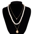 Detailed layered necklace set featuring white pearls, gold coin pendant and round crystal - Gold