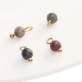 DIY gemstone charms in red, black, and green colors for jewelry making - Tourmaline