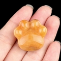 Polished natural yellow crystal cat paw carving ornament with translucent texture - Topaz
