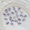 Sparkling light purple and champagne oval K9 crystal nail rhinestones in a white frame - Oval 6x8mm