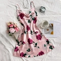 Pink satin floral slip dress with red rose print on white bedding, elegant summer style - Rose Pattern on Pink
