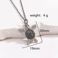 Silver sea turtle necklace with black and clear zircons, 20mm pendant on white surface - Silver Turtle Black and White Zirconia (Style 8 Platinum)