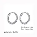 Detail view of round earrings with 12mm inner diameter and 2.5mm wire diameter - Steel Color / Half Star Pattern