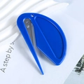 Blue safety box cutter and letter opener tool placed on a stylish white textured tray - Blue
