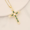 18K gold-plated cross pendant necklace with marquise green zircon on a ceramic tray - Green
