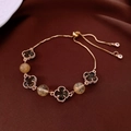 Elegant gold clover bracelet featuring brownish gemstones and yellow crystal beads - Gold - Brown Gem Clover Yellow Bead