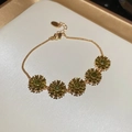 Detail of 18k gold plated flower bracelet with olive green crystals and lobster clasp - Gold - Olive Green