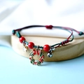 Braided Christmas couple bracelet with red beads, star, bell and holiday wreath charm - Bowknot Gift