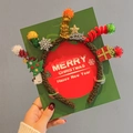 Brown tinsel Christmas headband with LED lights and festive miniature ornaments - Light Up Twisted Christmas Tree