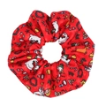 Detailed view of red Christmas scrunchie with snowmen and reindeer festive patterns - Red