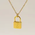 Minimalist gold necklace with padlock pendant featuring engraved artistic letter Z - Letter Z Style