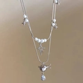Silver double layer pearl necklace with star and Saturn pendant featuring pear cut zircon - Silver Four-Pointed Star