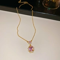 Macro shot of gold necklace with pink oval gemstones and sparkling cubic zirconia details - Chain Only / Gold-Pink