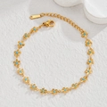 18K gold plated stainless steel daisy bracelet featuring blue turquoise style center beads - Blue Flower Bracelet