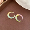 Detailed close-up of iridescent C-shaped acrylic earrings on a brown display tray - 925 Sterling Silver Earring Post/Acrylic / Multicolor Round