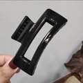 Minimalist black square claw clip with hollow design and smooth finish held in hand - Large 10.5cm Black