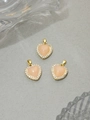 Three pink resin heart pendants with gold plating and cubic zirconia borders - Nude