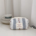 Detail of floral quilted cotton pouch with red cherry pattern and blue stripes - Red with Striped Small Flowers