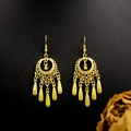 Macro detail of golden ethnic bell tassel earrings with intricate hollow-out leaf patterns - E5765-14 Hollow Lantern Shape Dangle