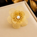Macro shot of 3D hollow gold flower ring with pearl center on beige leather texture - Warm Gold Hollow Floral With Pearl Style (R558)