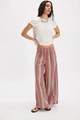 Detailed view of high-waist elastic band on striped wide-leg trousers for a comfortable fit - S / Pink