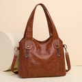 Large brown soft leather tote bag with dual handles and side zipper details for women - Tan