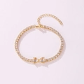 Elegant golden tennis bracelet featuring sparkling clear zircons and a central bow design motif - Heart to Heart Style (Clear Rhinestone) / Gold