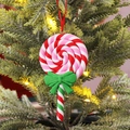 Colorful spiral lollipop Christmas ornament with green bow hanging on a tree - Pink Lollipop Style F