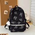 Black butterfly print backpack with reflective strip and white plush charm detail - Black With Cloud Pendant