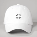 Detailed view of minimalist white cotton baseball cap with black embroidered smile pattern - White / One Size