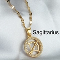 Golden Sagittarius zodiac pendant necklace with sparkling zircons on silk background - Sagittarius