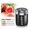 Peach fruity car air freshener with black cylindrical solid balm diffuser and silver lid - Peach