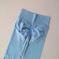 High-waisted light blue yoga pants with scrunch butt lifting design in seamless knit - Light Blue