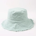 Detailed close-up of frayed edges and textured cotton fabric on a mint green bucket hat - Light Blue