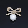 Elegant gold bow brooch with sparkling crystals and a white round pearl pendant - Rhinestone Bowknot Gold Pearl