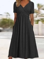 Detail of a black V-neck short sleeve dress with side pockets and soft fabric texture - S / Bottoms / Black