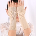 Detail of beige knit arm warmers featuring a leaf pattern cutout and fingerless design - Rice Pink