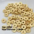 Detailed macro view of 6mm golden spacer beads with 1.5mm holes for DIY jewelry - 19 (6mm Disk Texture Bead)