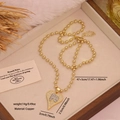 Tweekleurige hartketting met FE-initialen en zirkoon op een gouden kralenketting - FE Letter Hart Hanger