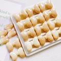 Detailed view of beige gradient bow beads arranged in a white tray for DIY crafts - 25mm / Gradient Beige-Coffee