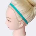 Slim turquoise silicone elastic sports headband on model for yoga and running - Pine Green