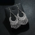 Bohemian vintage silver tassel earrings with geometric patterns on a black box - Antique Silver Geometric Hollow Tassel Style (E1667-1)